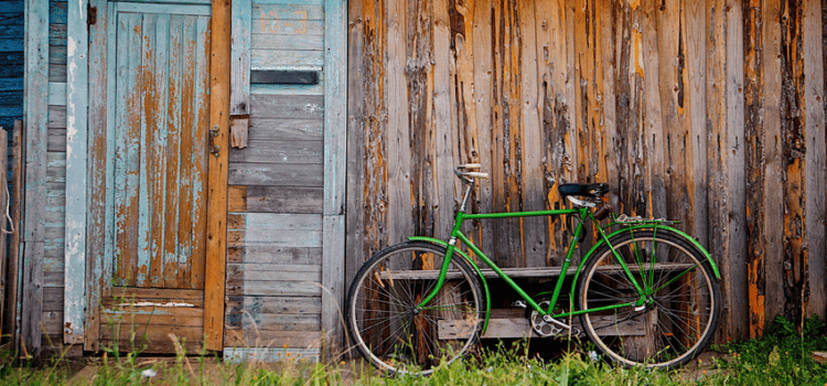 Old wooden wall and green bicycle Green Bicycle